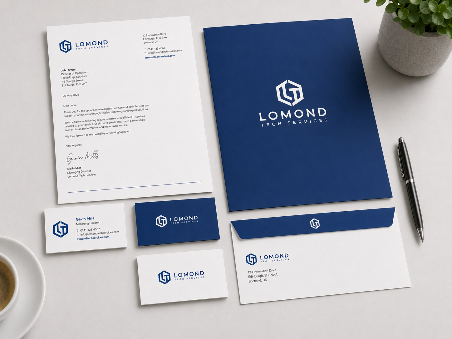 Lomond Tech Services stationery set featuring letterhead, envelopes, business cards, and branded print materials.
