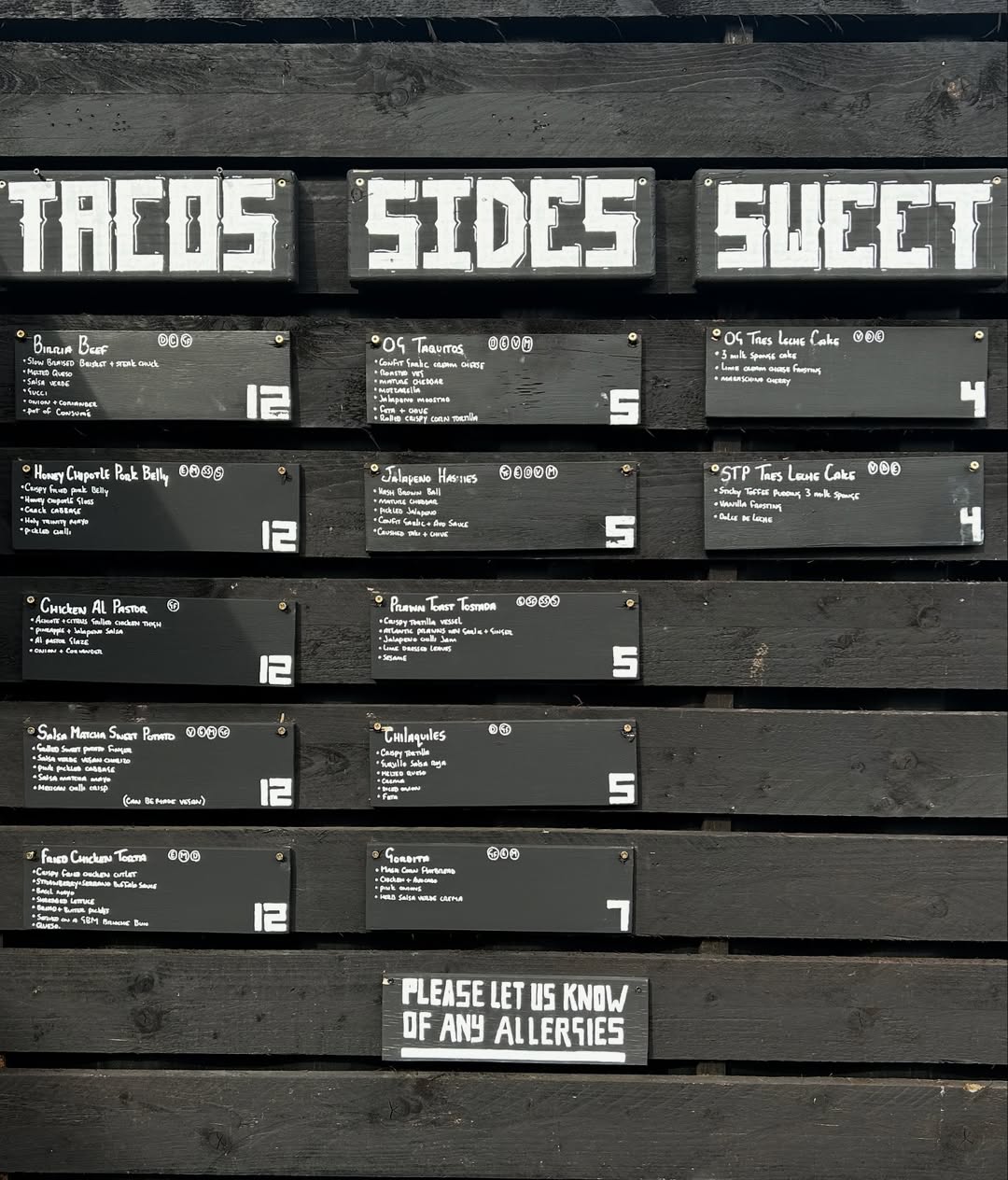 The Big Taquero menu board showing street-food dishes and visual brand texture.